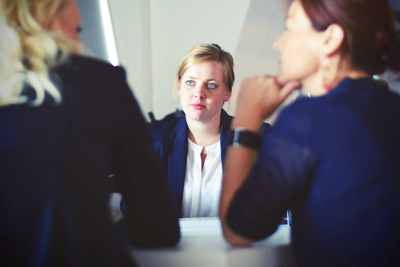 three women sitting beside table these are the Benefits of Human Resources Support Services