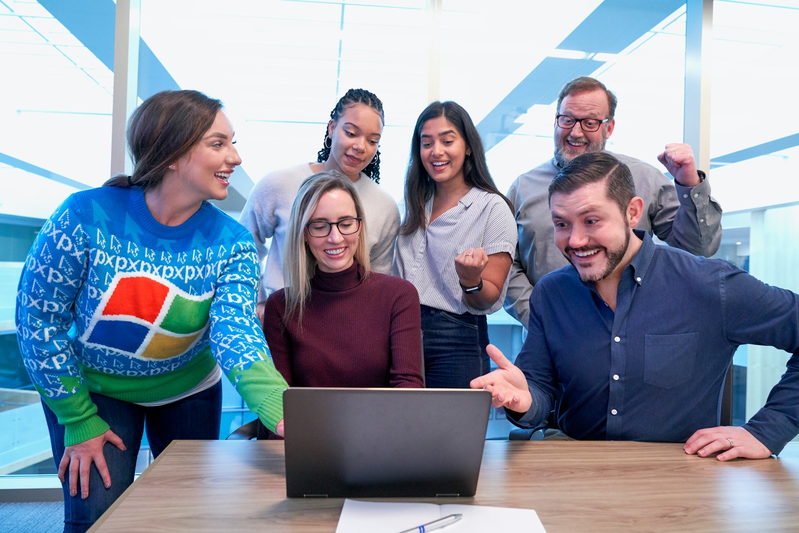 woman in maroon sweater using laptop this is how you improve employee retention